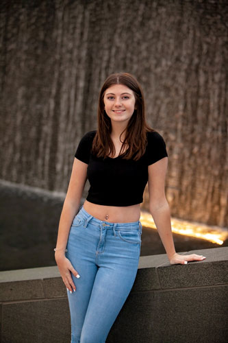 A High School Senior Posing for her Senior Photo Session