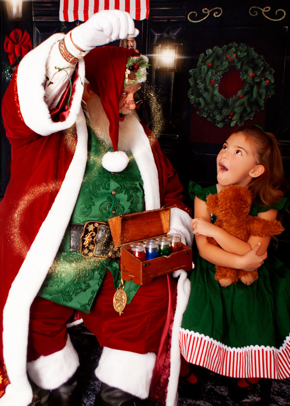 Santa posting with a child for Christmas photos in Hilliard, Ohio